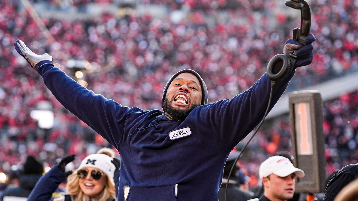 Michigan defensive backs coach LaMar Morgan celebrates 13-10 win over Ohio State at Ohio Stadium