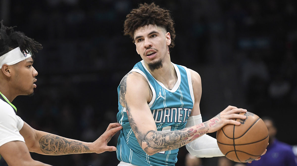 Charlotte Hornets guard LaMelo Ball (1) controls the ball as he is defended by Minnesota Timberwolves guard Terrence Shannon Jr. (00) during the first half at the Spectrum Center.