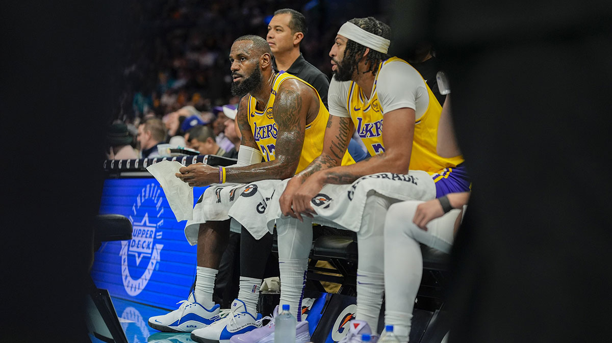 Lakers forward Anthony Davis (3) and Los Angeles Lakers forward LeBron James (23) during a timeout against the Charlotte Hornets during the first quarter at the Spectrum Center