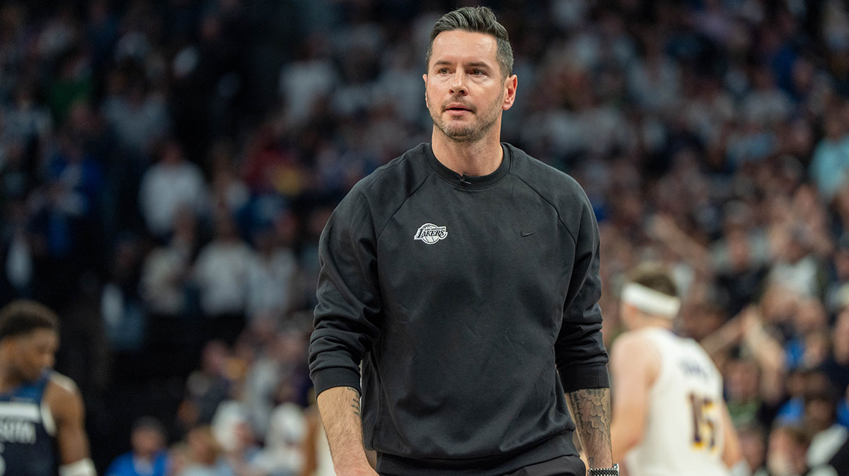 Lakers head coach JJ Redick reacts to his team losing the lead to the Minnesota Timberwolves late in the fourth quarter during game four of first round for the 2025 NBA Playoffs at Target Center next to Fox Sports 1's Nick Wright