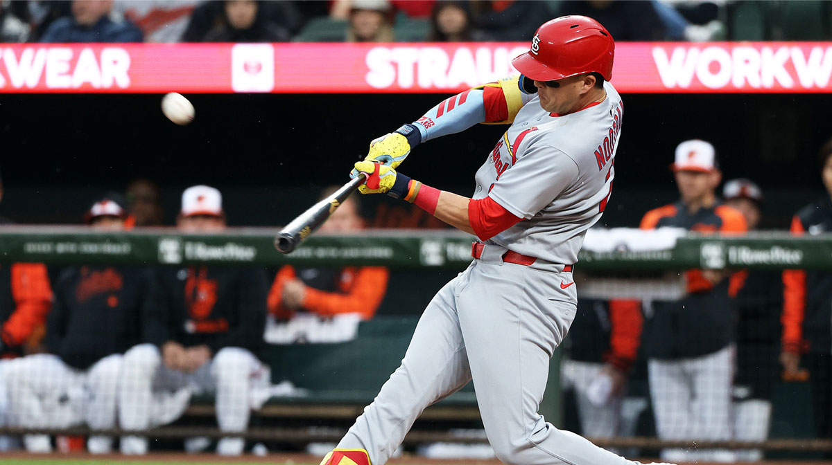 May 27, 2025; Baltimore, Maryland, USA; St. Louis Cardinals outfielder Lars Nootbaar (21) hits a home run during the second inning against the Baltimore Orioles at Oriole Park at Camden Yards.