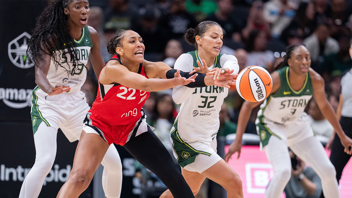 Las Vegas Aces center A'ja Wilson (22) passes the ball against Seattle Storm forward Alysha Clark (32)during the second half at Climate Pledge Arena.