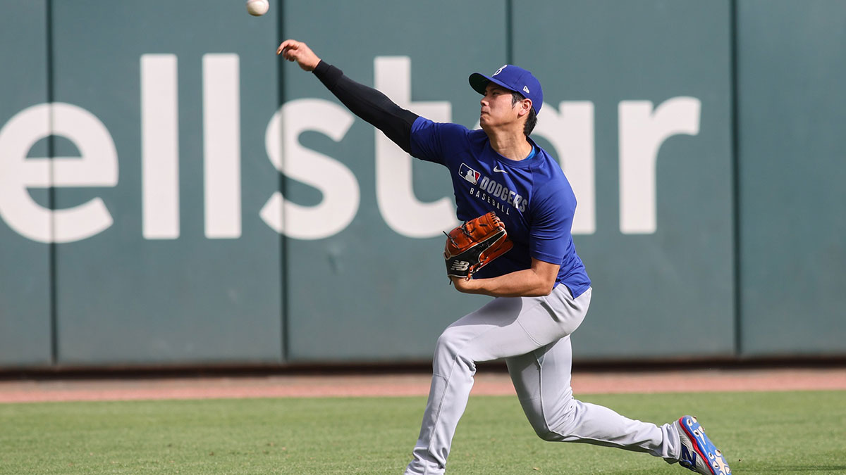 Los Angeles Dodgers designated hitter Shohei Ohtani (17) throws before a game against the Atlanta Braves at Truist Park.