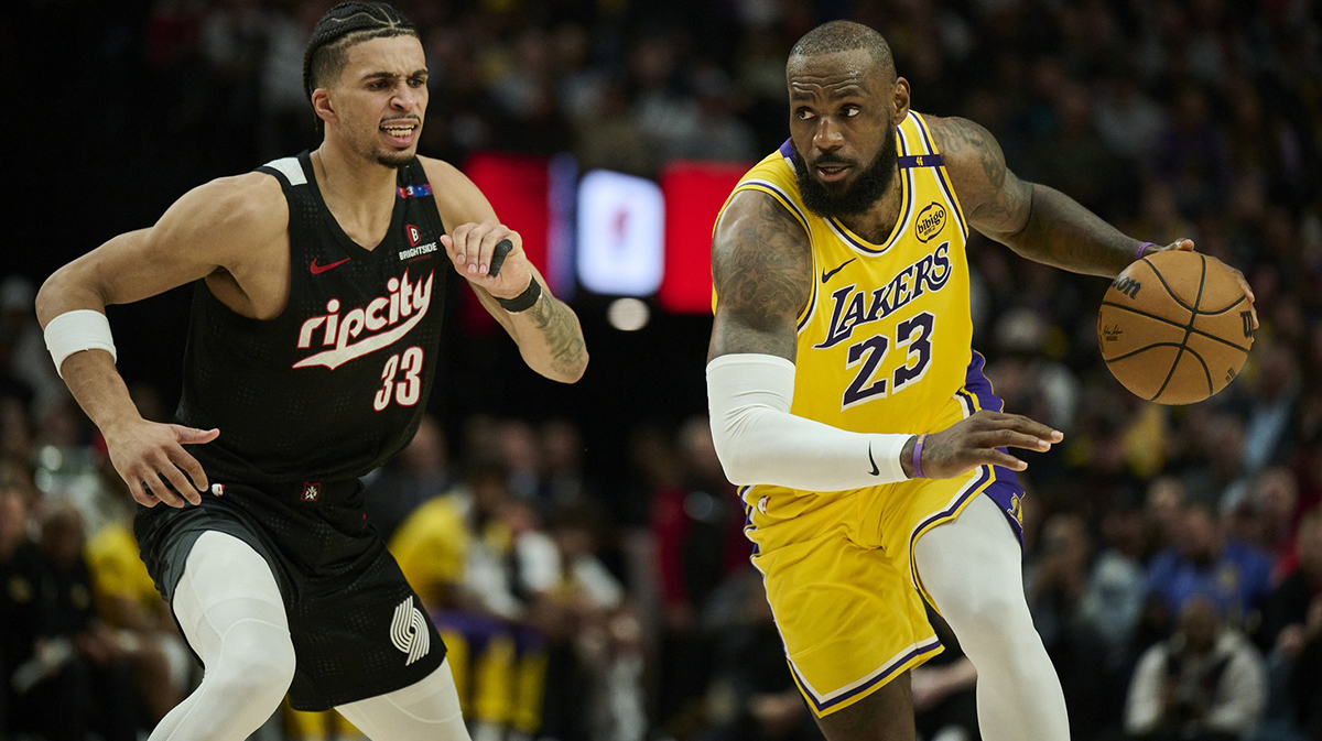 Los Angeles Lakers forward LeBron James (23) drives to the basket during the second half against Portland Trail Blazers forward Toumani Camara (33) at Moda Center.