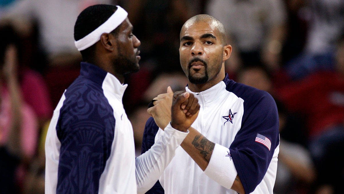 USA forward Lebron James (left) greets teammate Carlos Boozer before a preliminary round game against Germany at the Beijing Olympic Basketball Gymnasium during the 2008 Beijing Olympic Games. USA beat Germany 106-57.