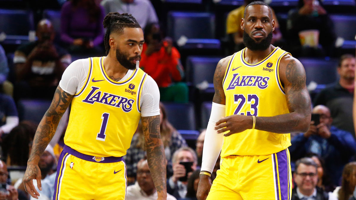 Los Angeles Lakers guard D'Angelo Russell (1) and forward LeBron James (23) wait for play to start against the Memphis Grizzlies at FedExForum.