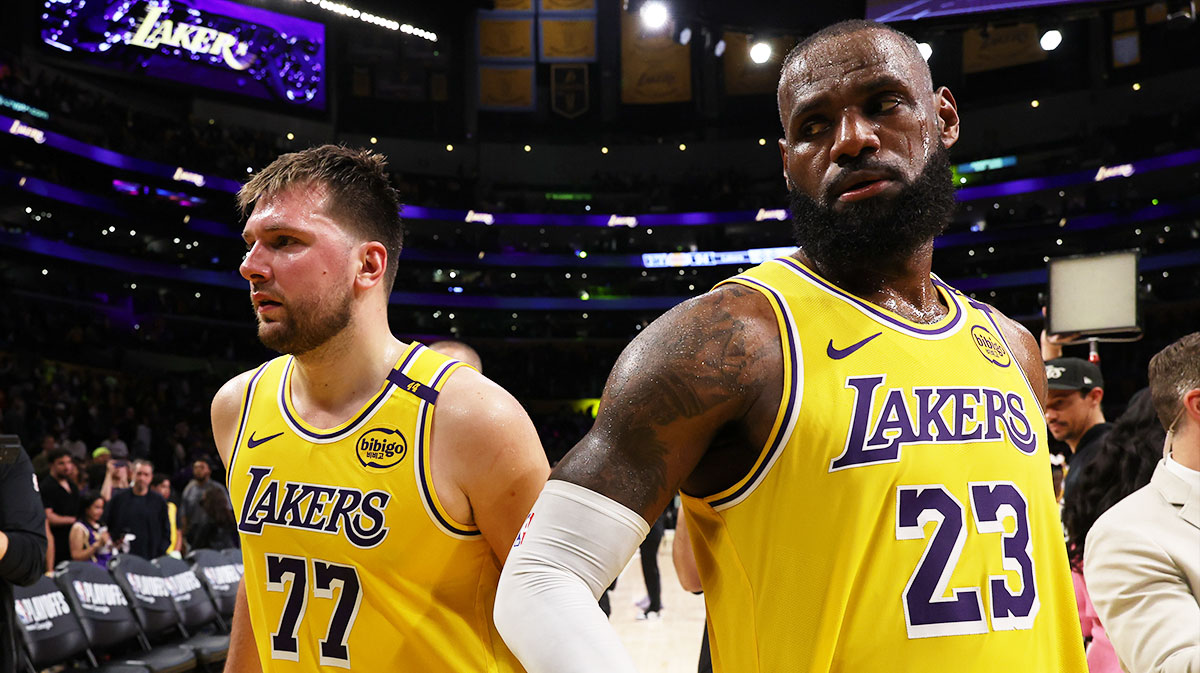Los Angeles Lakers guard Luka Doncic (77) and Los Angeles Lakers forward LeBron James (23) leave a court after defeating the Minnesota Timberwolves 94-85 in game two of first round for the 2024 NBA Playoffs at Crypto.com Arena.