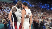 United States guard LeBron James (6) and shooting guard Stephen Curry (4) celebrate after the game against Serbia in a men's basketball semifinal game during the Paris 2024 Olympic Summer Games at Accor Arena.