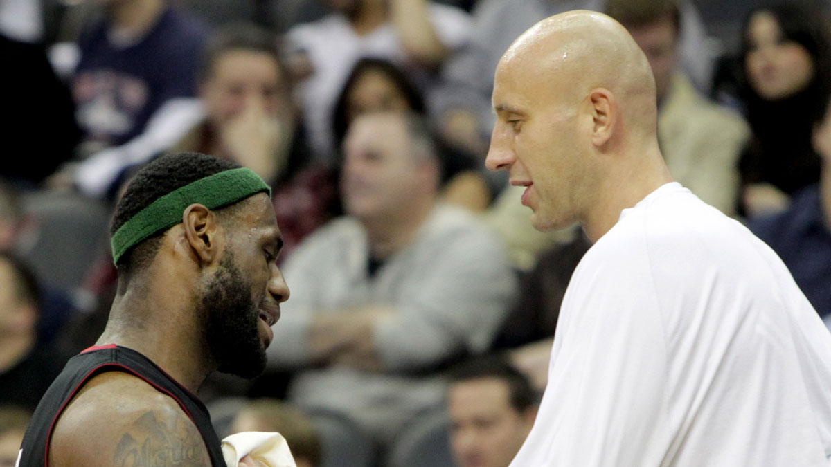 Miami Heat forward LeBron James (6) talks with center Zydrunas Ilgauskas (11) during the first half against New Jersey Nets at the Prudential Center.