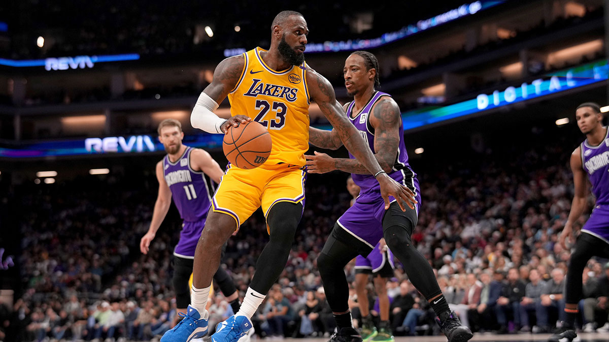 Los Angeles Lakers forward LeBron James (23) dribbles the ball next to Sacramento Kings guard DeMar DeRozan (10) in the first quarter at the Golden 1 Center.