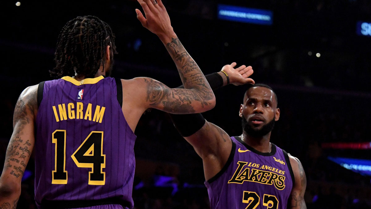 Los Angeles Lakers forward LeBron James (23) celebrates with forward Brandon Ingram (14) against the Portland Trail Blazers during the first half at Staples Center.