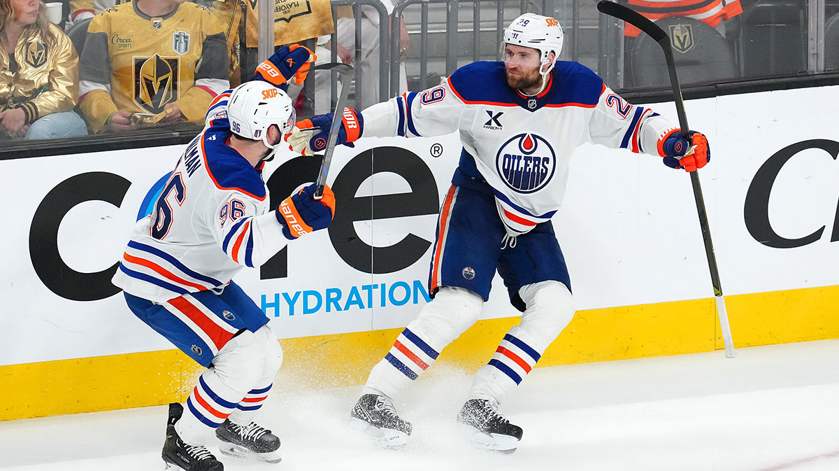 Edmonton Oilers center Leon Draisaitl (29) celebrates with defenseman Jake Walman (96) after scoring a game-winning goal against the Vegas Golden Knights during an overtime period of game two of the second round of the 2025 Stanley Cup Playoffs at T-Mobile Arena.
