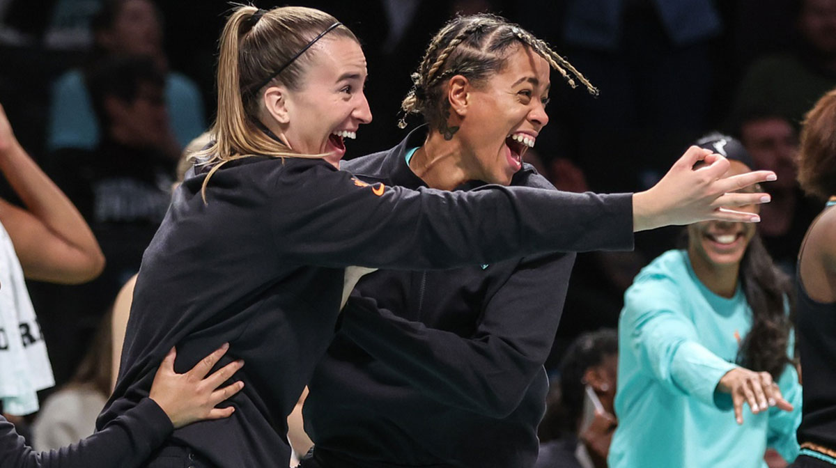 New York Liberty guards Sabrina Ionescu (20) and Natasha Cloud (9) celebrate from the bench in the fourth quarter against the Connecticut Sun at Barclays Center.