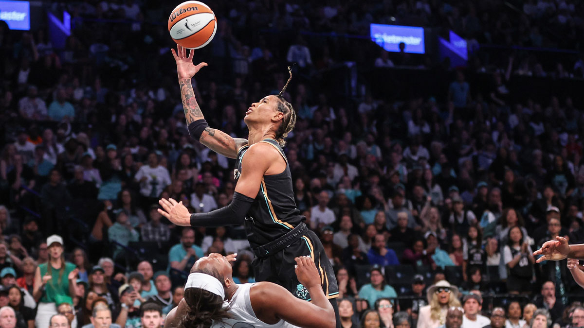 May 17, 2025; Brooklyn, New York, USA; New York Liberty guard Natasha Cloud (9) is fouled driving to the basket by Las Vegas Aces guard Chelsea Gray (12) in the fourth quarter at Barclays Center. Mandatory Credit: Wendell Cruz-Imagn Images