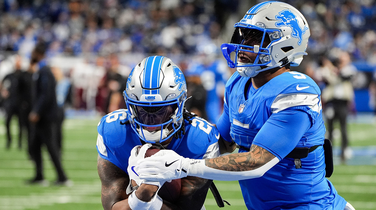 Detroit Lions running back Jahmyr Gibbs (26) warms up with running back David Montgomery (5) before the NFC divisional round at Ford Field in Detroit on Saturday, Jan. 18, 2025.