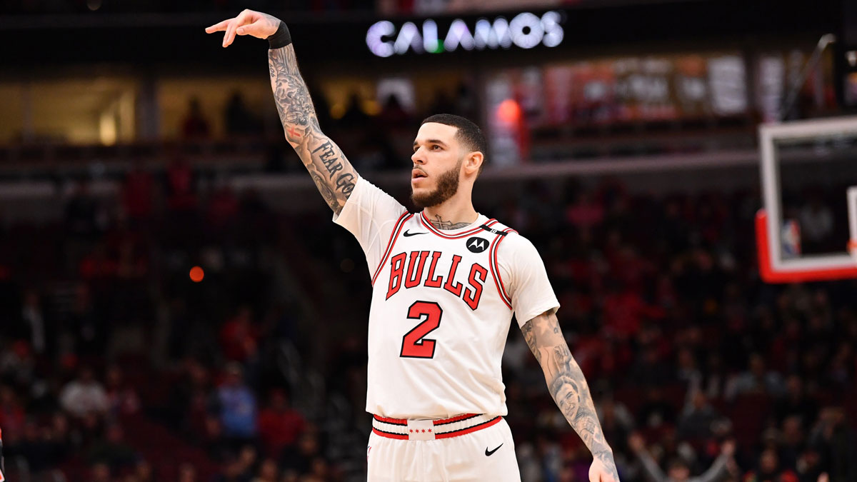 Chicago Bulls forward Lonzo Ball (2) hits a three point shot against Toronto Raptors guard Jamal Shead (23) during overtime at the United Center.