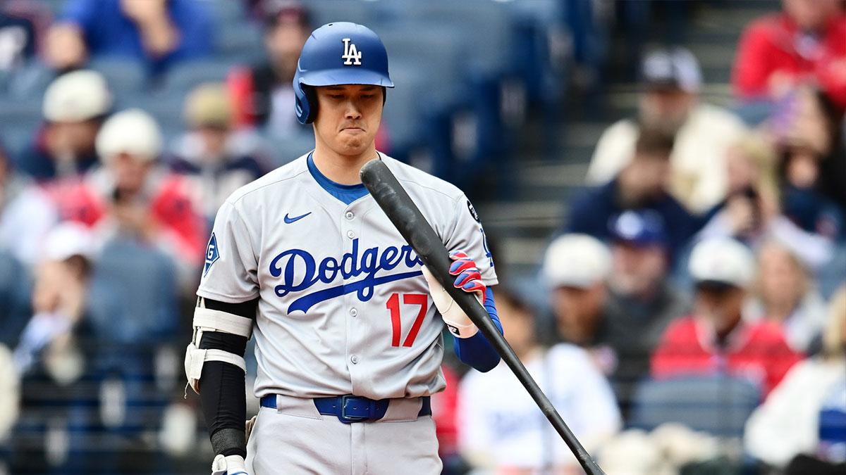 Los Angeles Dodgers designated hitter Shohei Ohtani (17) inspects his bat during the third inning against the Cleveland Guardians at Progressive Field.