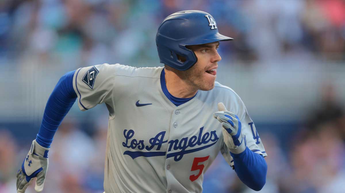 May 5, 2025; Miami, Florida, USA; Los Angeles Dodgers first baseman Freddie Freeman (5) runs toward third base after hitting a three-run triple against the Miami Marlins during the seventh inning at loanDepot Park. Mandatory Credit: Sam Navarro-Imagn Images