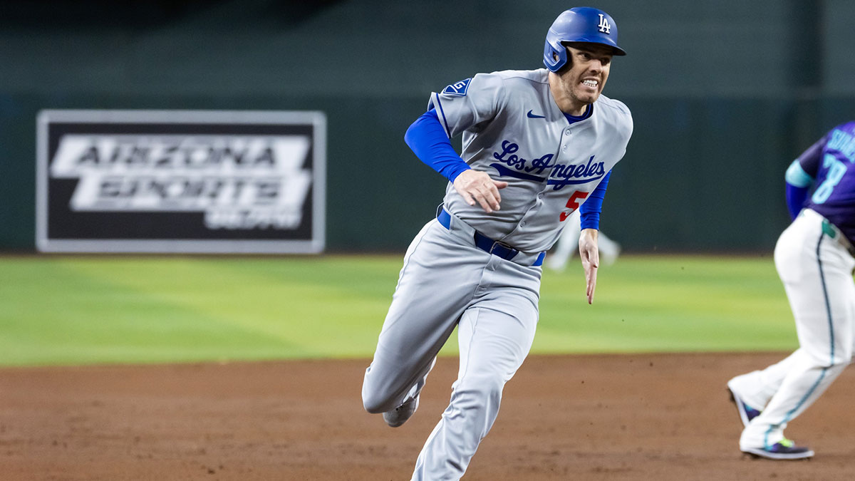 Los Angeles Dodgers first baseman Freddie Freeman scores in the third inning against the Arizona Diamondbacks at Chase Field.