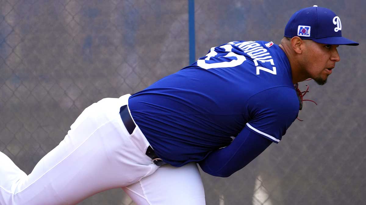 Los Angeles Dodgers pitcher Edgardo Henriquez (60) throws during a Spring Training workout at Camelback Ranch.