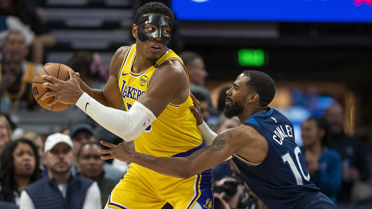 Los Angeles Lakers forward Rui Hachimura (28) backs towards the basket as Minnesota Timberwolves guard Mike Conley (10) plays defense in the first half during game three of first round for the 2024 NBA Playoffs at Target Center.