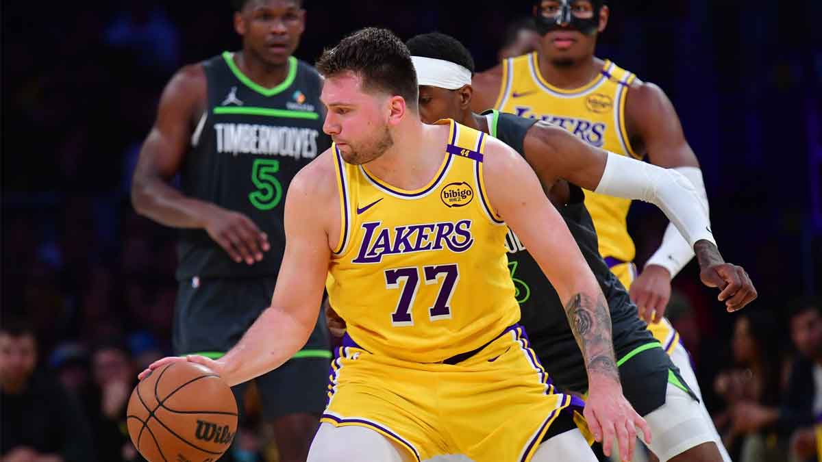 Los Angeles Lakers guard Luka Doncic (77) controls the ball against the Minnesota Timberwolves during the second half in game five of first round for the 2025 NBA Playoffs at Crypto.com Arena.