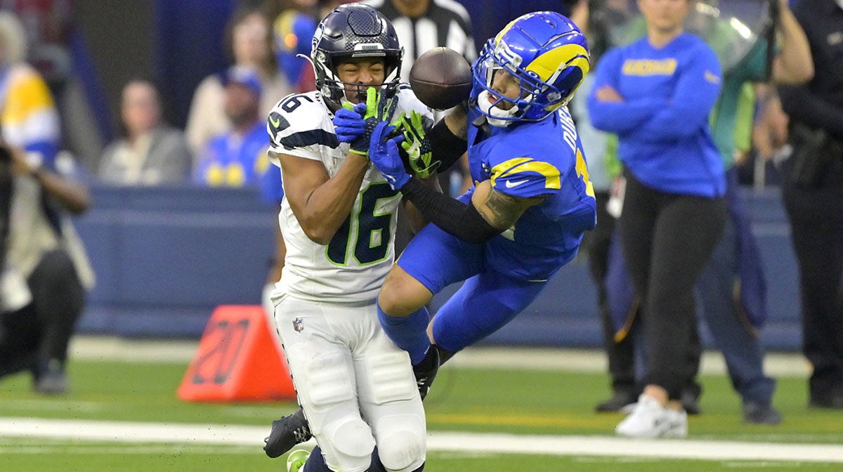 Los Angeles Rams cornerback Cobie Durant (14) breaks up a pass for Seattle Seahawks wide receiver Tyler Lockett (16) in the second half against at SoFi Stadium.