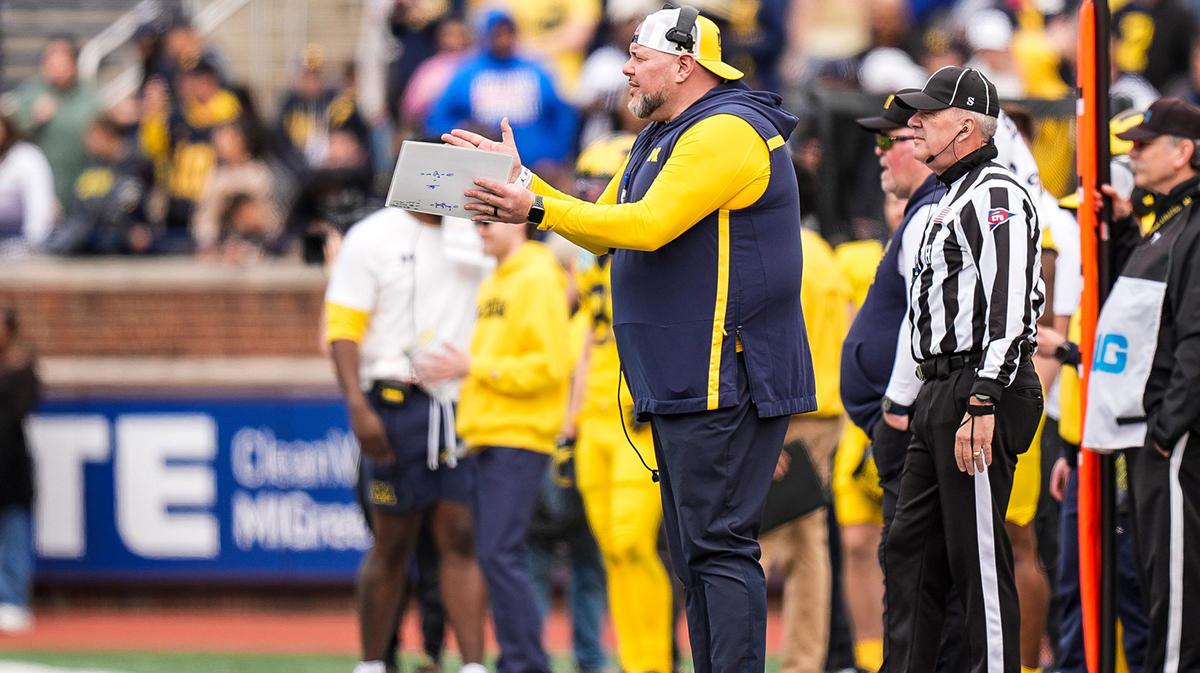 Michigan defensive line coach Lou Esposito watches a play against Team Blue during the second half of the spring game at Michigan Stadium