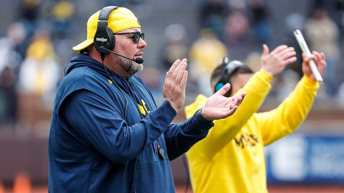 Michigan defensive line coach Lou Esposito watches a play during the second half of the spring game at Michigan Stadium