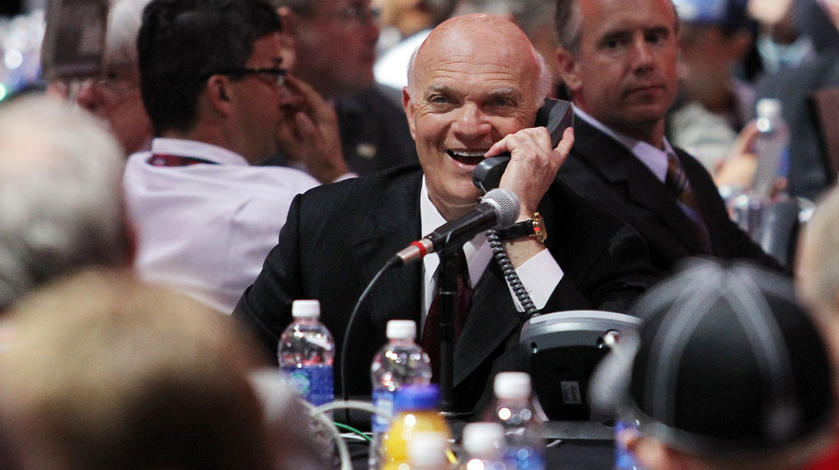 New Jersey Devils general manager Lou Lamoriello speaks on the phone during the 2013 NHL Draft at the Prudential Center.