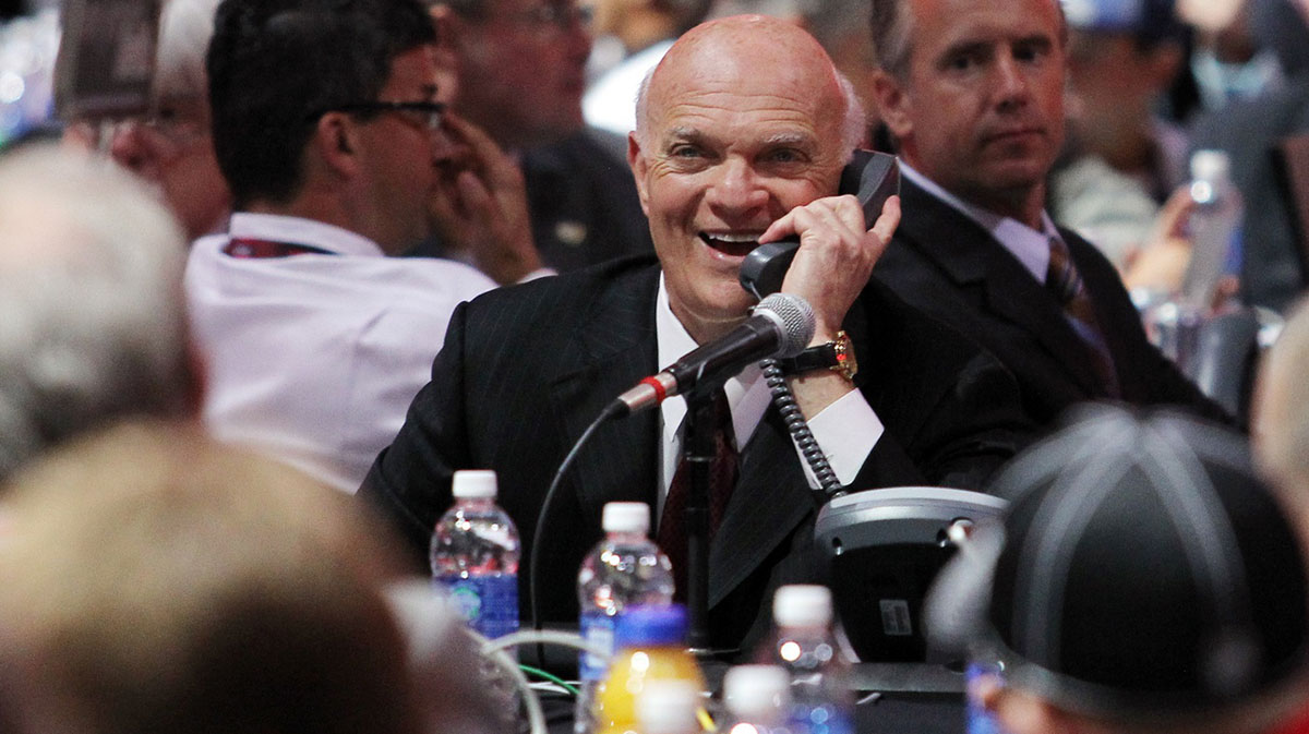 New Jersey Devils general manager Lou Lamoriello speaks on the phone during the 2013 NHL Draft at the Prudential Center.
