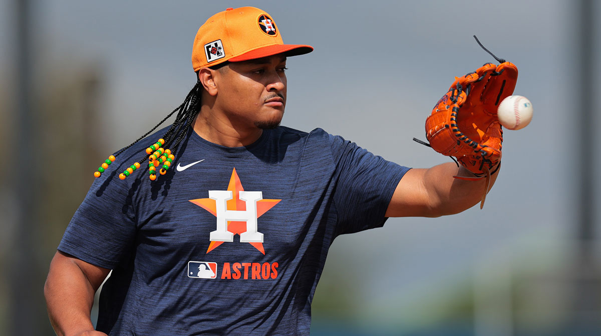Houston Astros starting pitcher Luis Garcia (77) works on a fielding exercise during a spring training workout at CACTI Park of the Palm Beaches.