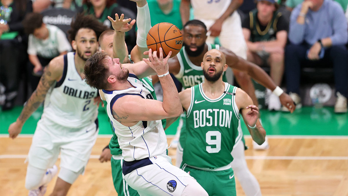Dallas Mavericks guard Luka Doncic (77) shoots the ball against the Boston Celtics during the third quarter in game five of the 2024 NBA Finals at TD Garden.