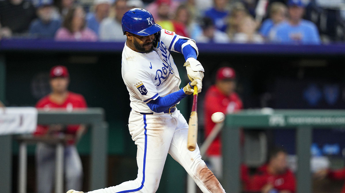 Kansas City Royals designated hitter Maikel Garcia (11) hits a single during the sixth inning against the Cincinnati Reds at Kauffman Stadium.