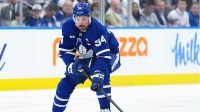 Toronto Maple Leafs center Auston Matthews (34) skates with the puck against the Florida Panthers during the first period in game two of the second round of the 2025 Stanley Cup Playoffs at Scotiabank Arena.