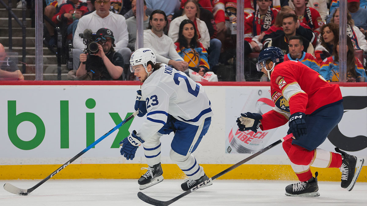 Toronto Maple Leafs left wing Matthew Knies (23) moves the puck past Florida Panthers defenseman Seth Jones (3) during the first period in game six of the second round of the 2025 Stanley Cup Playoffs at Amerant Bank Arena.