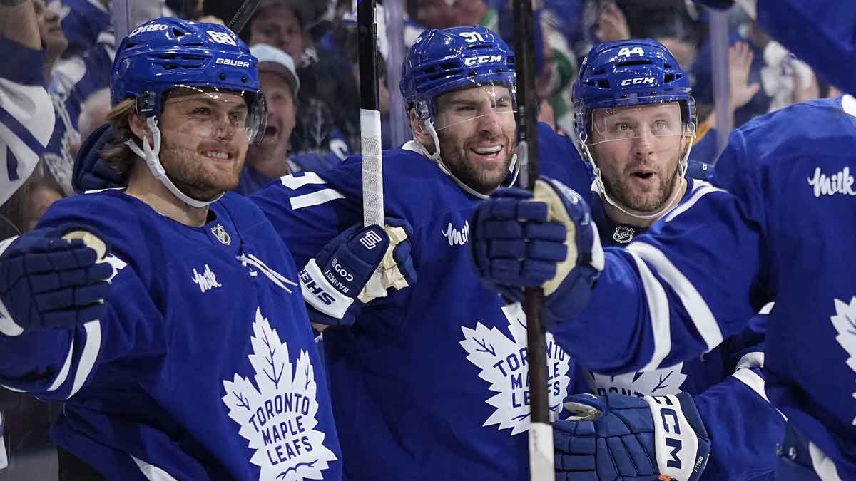 Toronto Maple Leafs forward William Nylander (88) celebrates with defenseman Morgan Rielly (44) and forward John Tavares (91) after his second goal of the first period against the Florida Panthers during the second round of the 2025 Stanley Cup Playoffs at Scotiabank Arena.