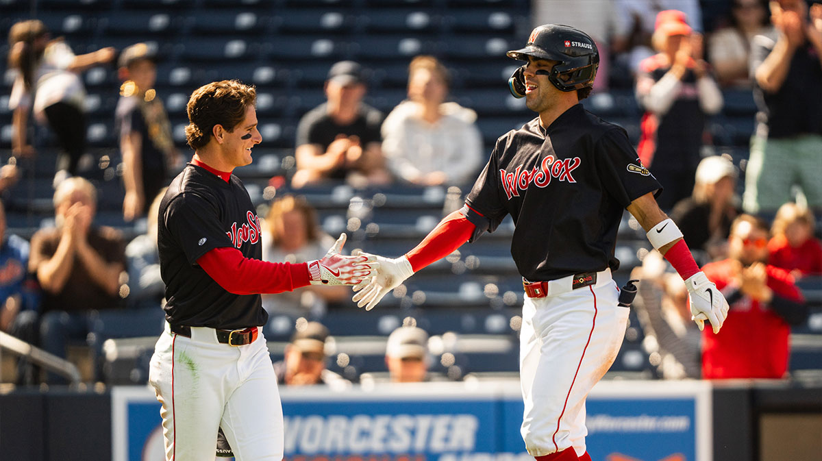 Roman Anthony (left) high fives teammate Marcelo Mayer during a Triple-A game.