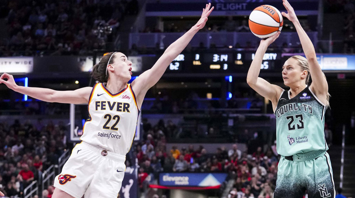 New York Liberty guard Marine Johannès (23) goes up for a 3-pointer against Indiana Fever guard Caitlin Clark (22) during a game between the Indiana Fever and the New York Libertyat Gainbridge Fieldhouse.