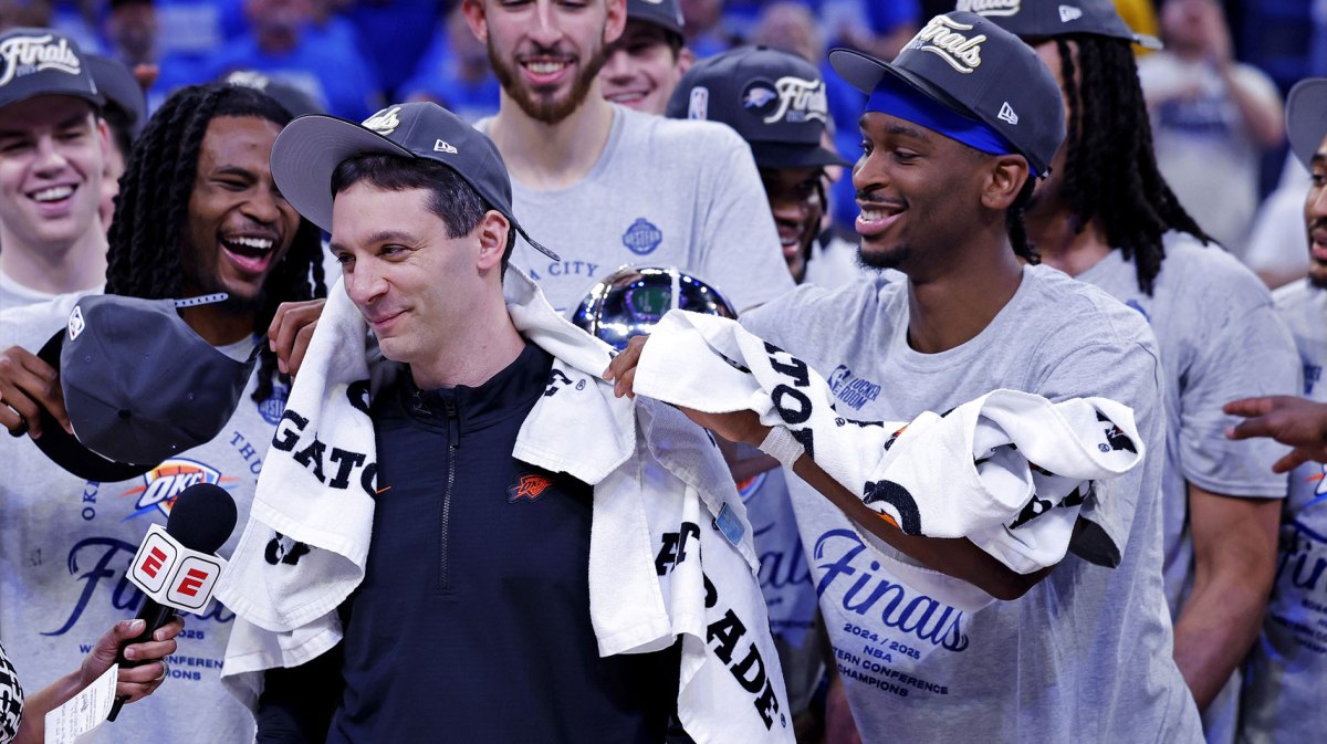 Oklahoma City Thunder head coach Mark Daigneault celebrates with his team after defeating the Minnesota Timberwolves in game five to win the western conference finals for the 2025 NBA Playoffs at Paycom Center.
