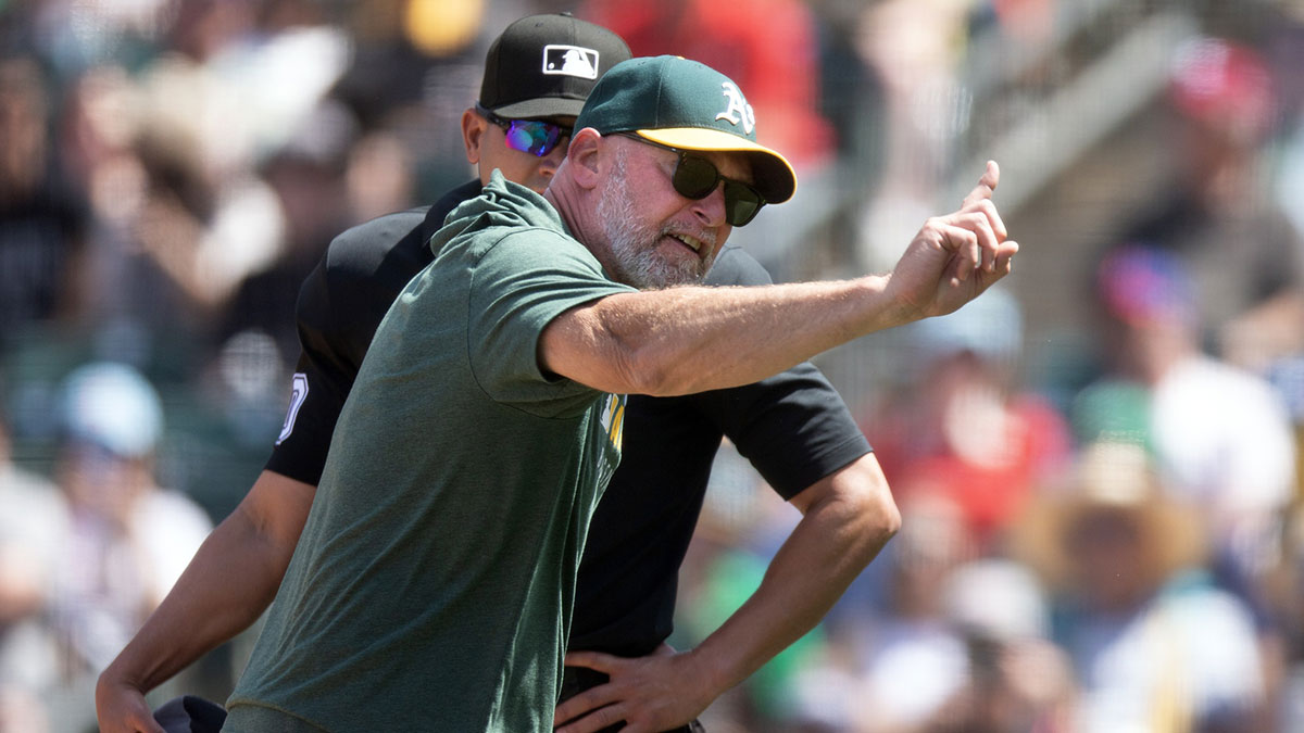 Athletics manager Mark Kotsay (right) argues with home plate umpire Roberto Ortiz after being ejected from the game against the Philadelphia Phillies during the seventh inning at Sutter Health Park.