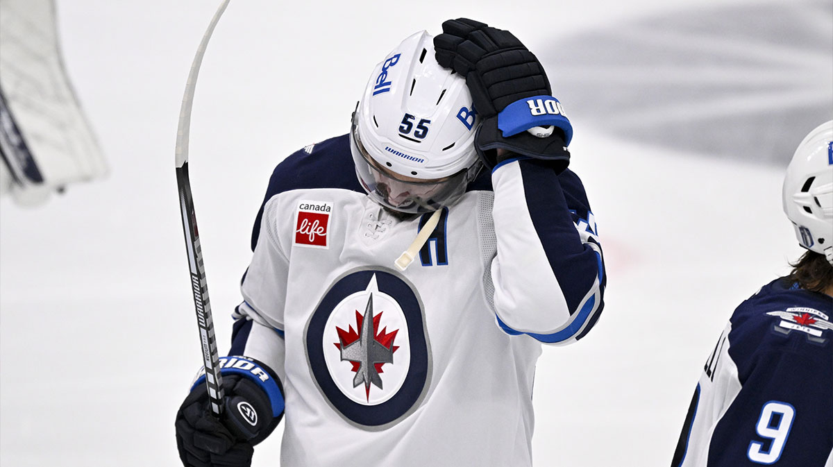 Winnipeg Jets center Mark Scheifele (55) looks down after the Dallas Stars defeat the Jets in the overtime period in game six of the second round of the 2025 Stanley Cup Playoffs at American Airlines Center.