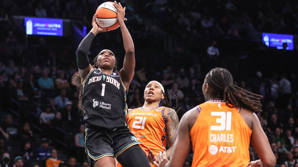 Marquesha Davis (1) drives past Connecticut Sun guard Marina Mabrey (3) and forward Robyn Parks (21) in the second quarter at Barclays Center.
