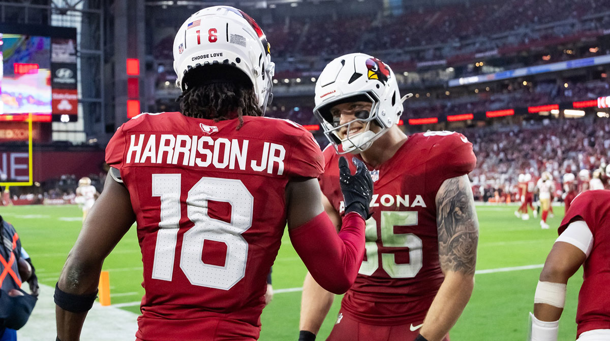 Arizona Cardinals wide receiver Marvin Harrison Jr. (18) celebrates a touchdown with tight end Trey McBride (85) against the San Francisco 49ers in the second half at State Farm Stadium.