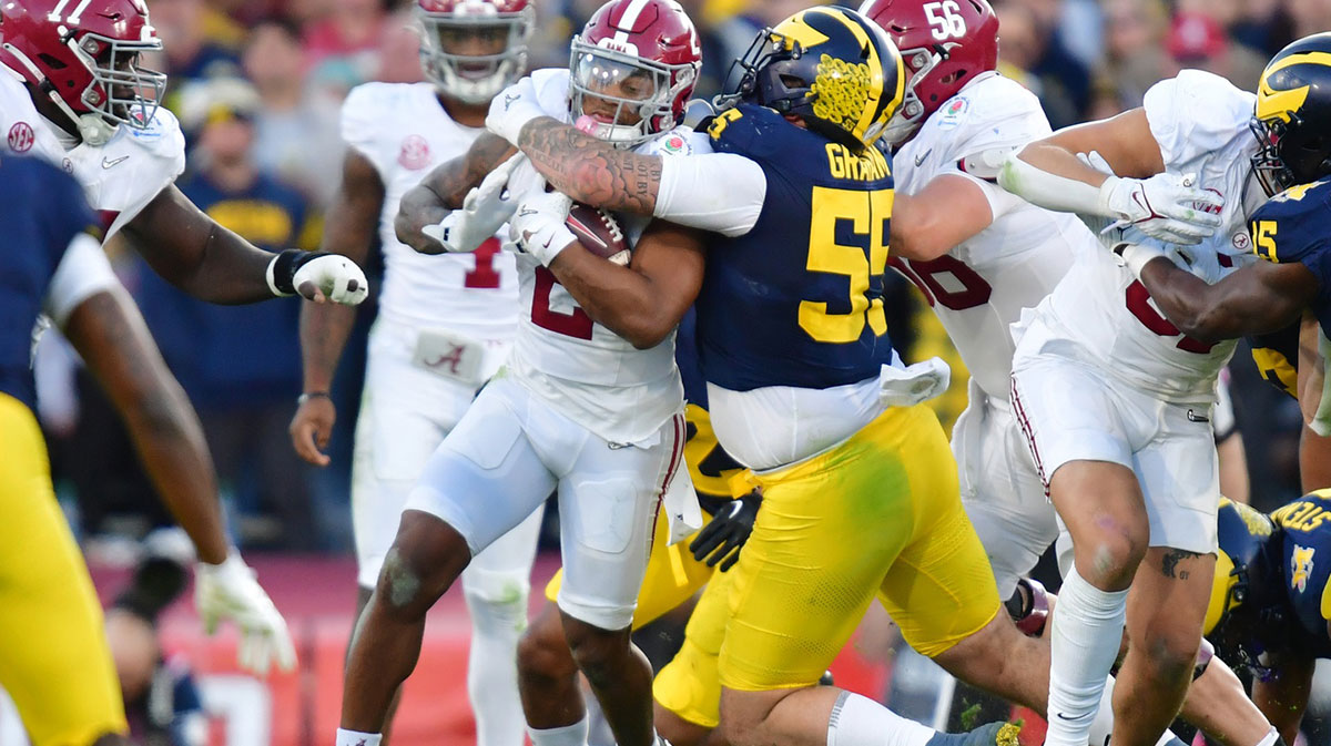 Jan 1, 2024; Pasadena, CA, USA; Michigan Wolverines defensive lineman Mason Graham (55) tackles Alabama Crimson Tide running back Jase McClellan (2) in the third quarter in the 2024 Rose Bowl college football playoff semifinal game at Rose Bowl.
