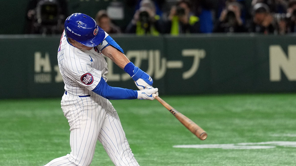Mar 16, 2025; Bunkyo, Tokyo, Japan; Chicago Cubs third baseman Matt Shaw (6) hits an RBI single against the Yomiuri Giants during the fifth inning at Tokyo Dome.