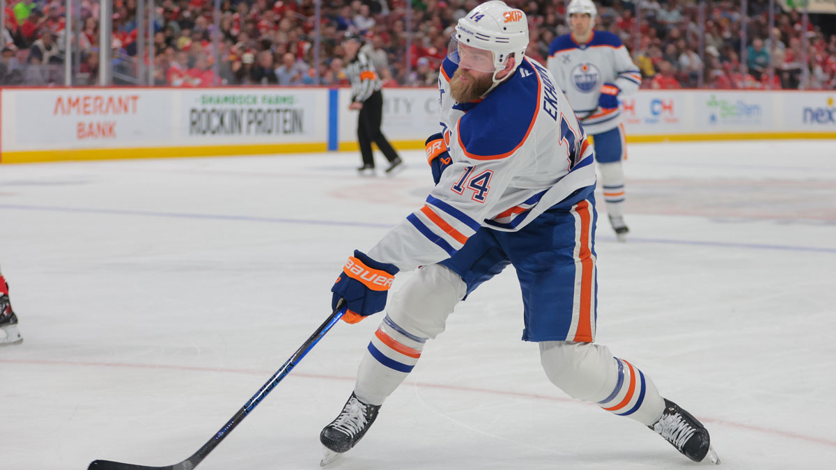 Edmonton Oilers defenseman Mattias Ekholm (14) shoots the puck against the Florida Panthers during the first period at Amerant Bank Arena.