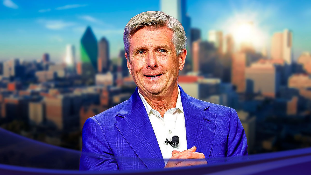 Mavericks Rick Welts with the Dallas skyline in background.