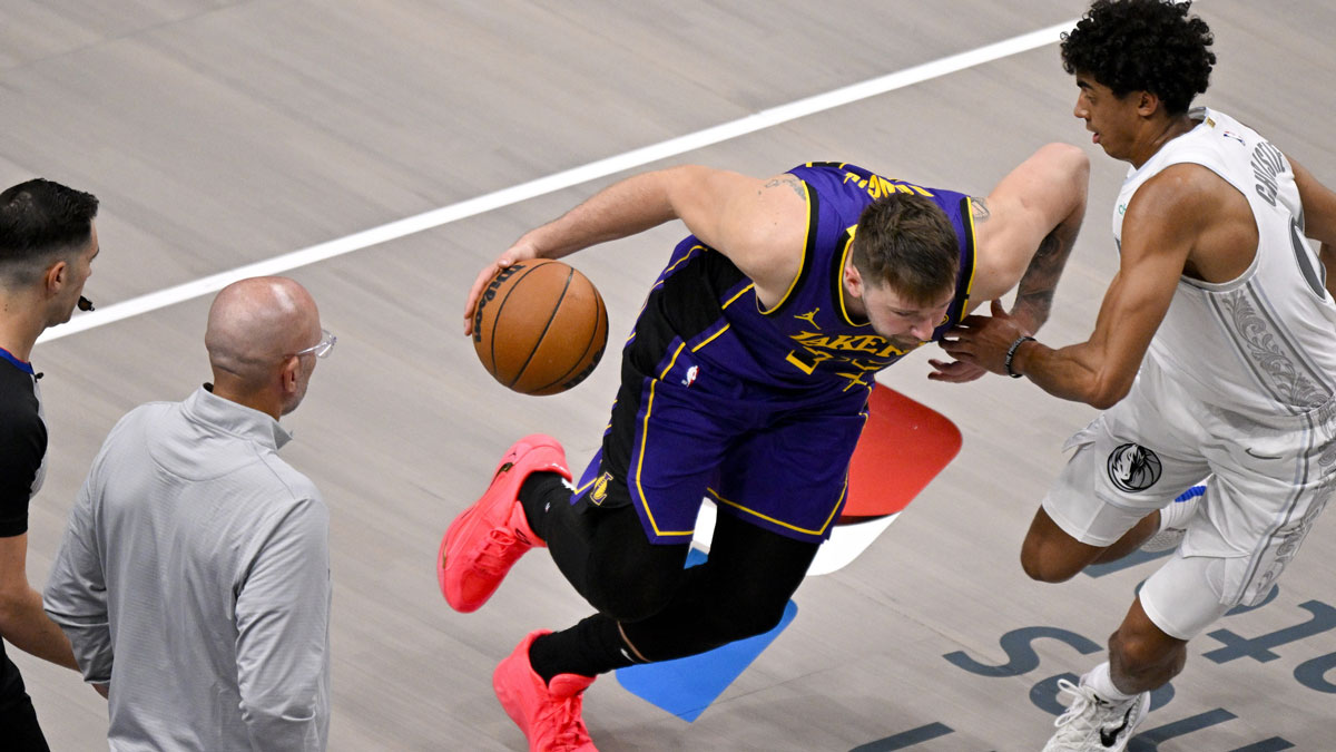 Dallas Mavericks head coach Jason Kidd and Los Angeles Lakers guard Luka Doncic (77) and guard Max Christie (00) during the game between the Dallas Mavericks and the Los Angeles Lakers at American Airlines Center.