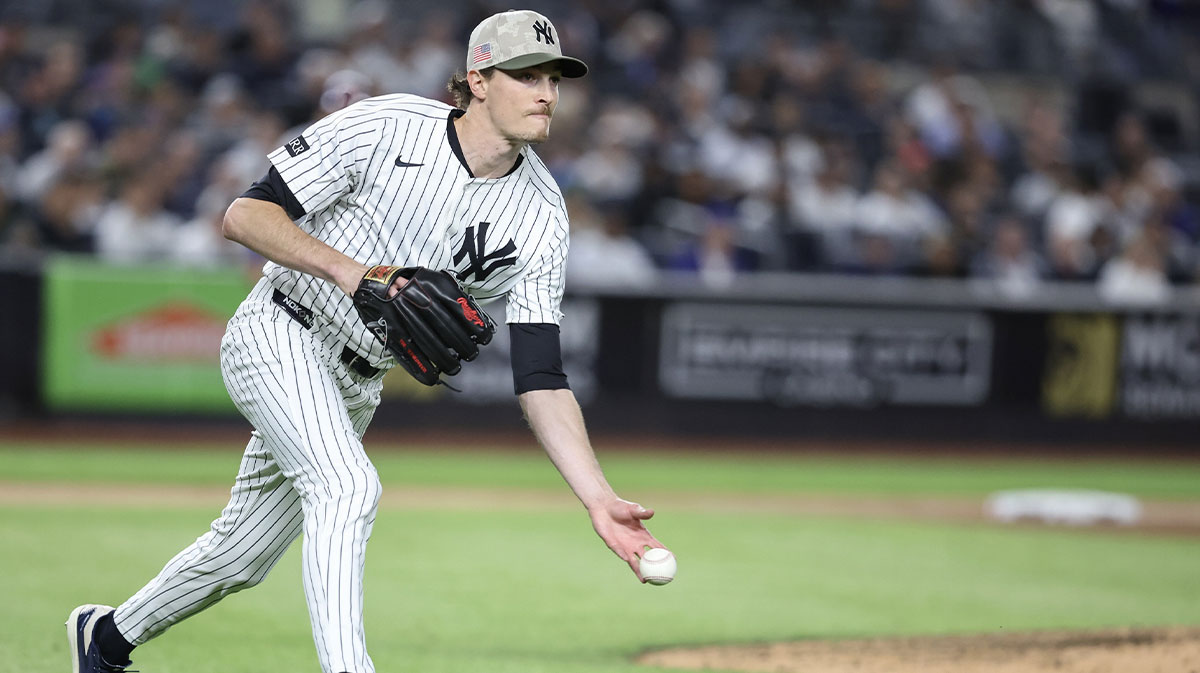 New York Yankees starting pitcher Max Fried (54) throws a runner out at first base in the fifth inning against the New York Mets at Yankee Stadium.